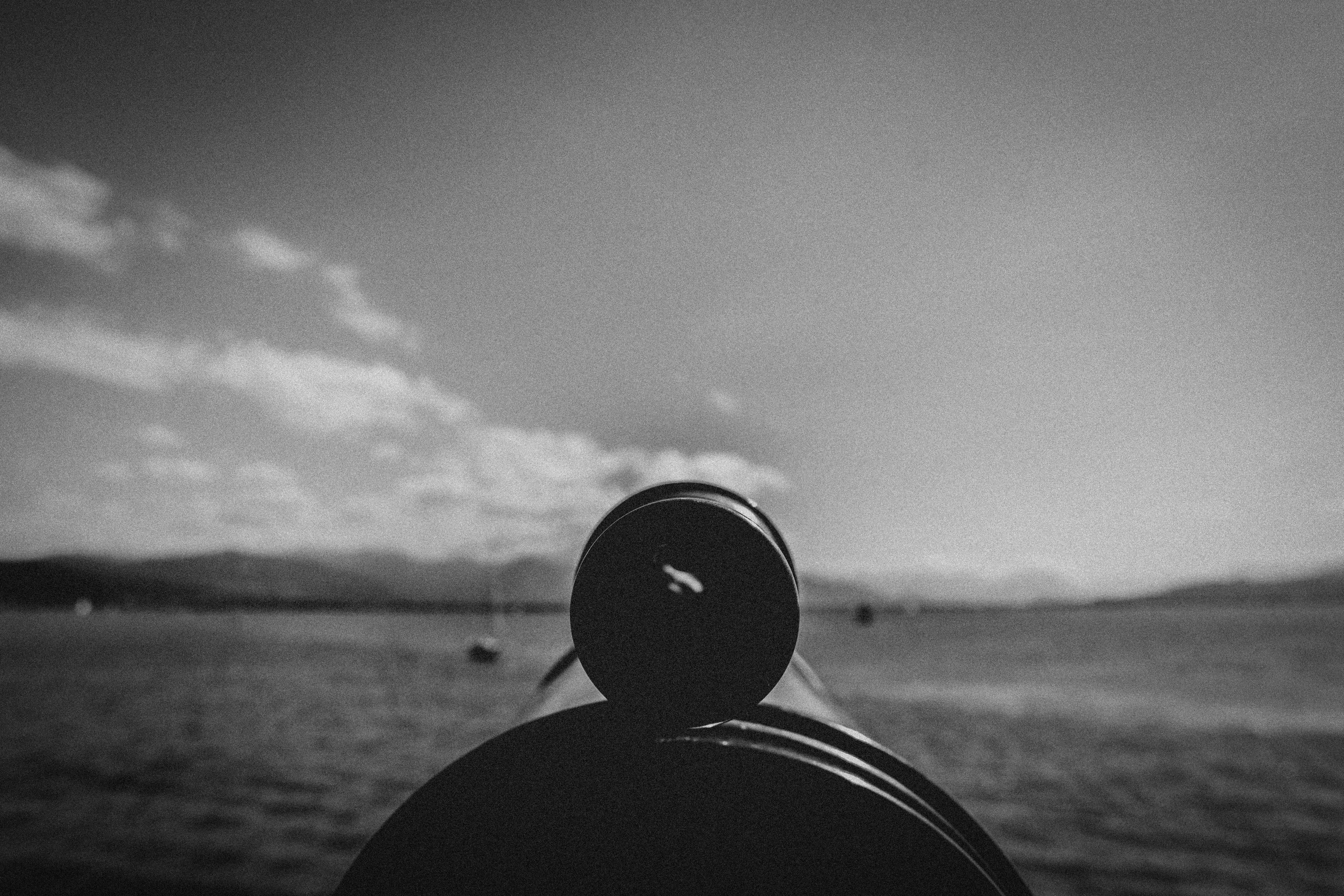 grayscale photo of a person wearing a hat